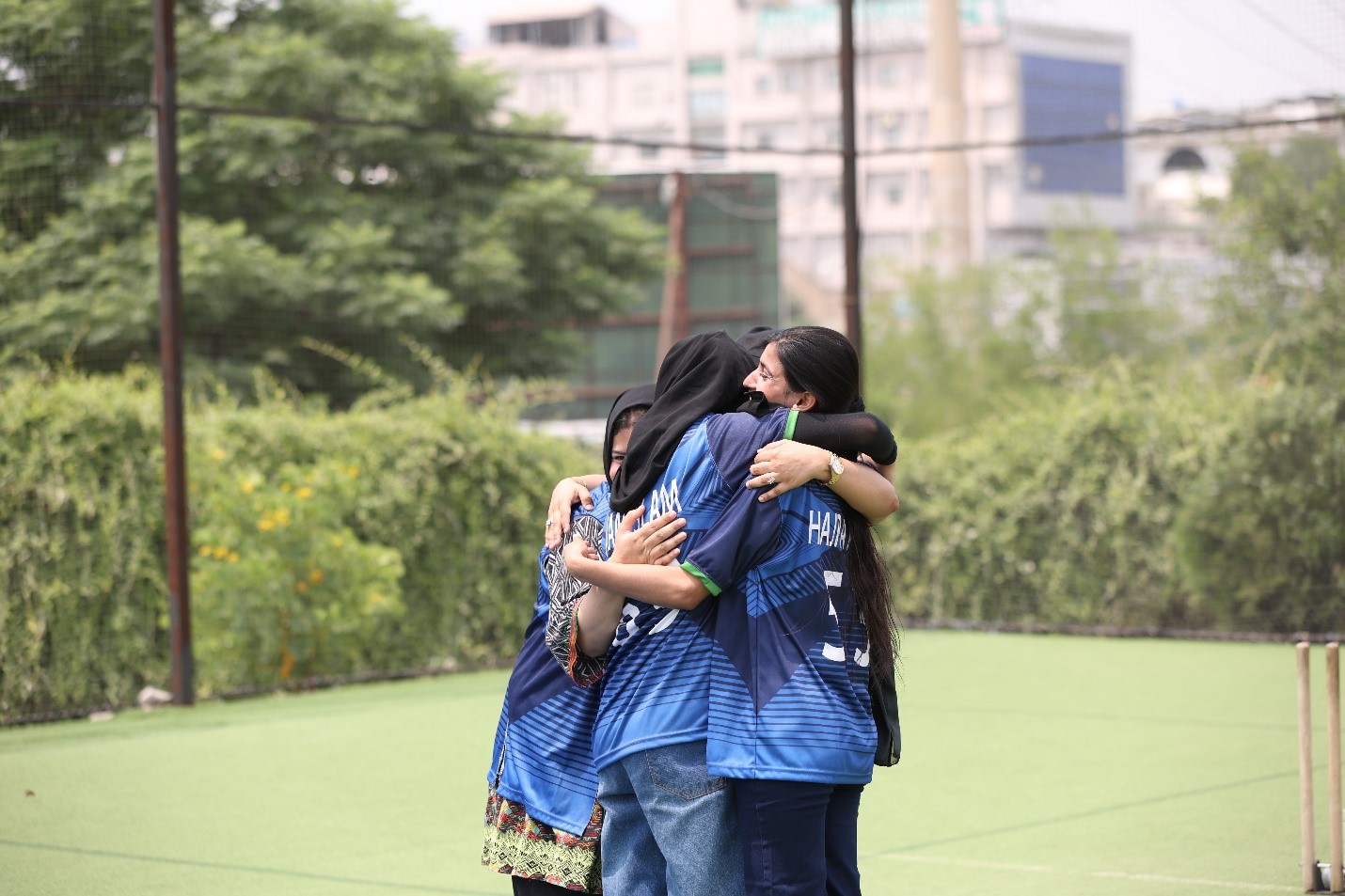 University students embracing and supporting one another on campus.